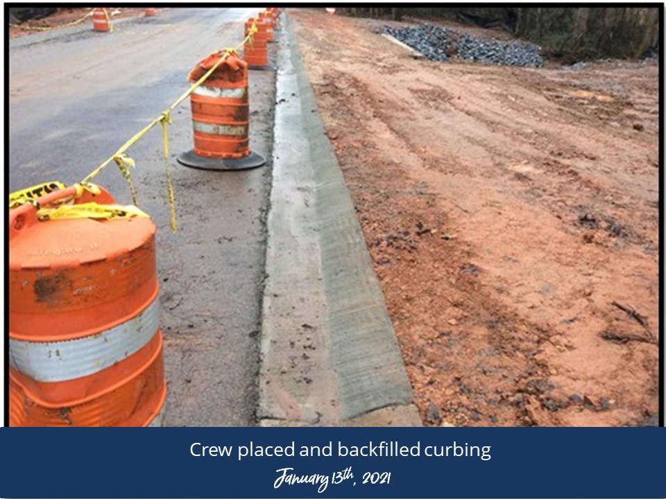 Workers arranging and cutting materials at a job site